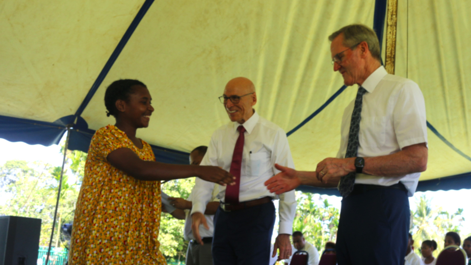 Elder-Valenzuela-and-Elder-Meurs-congratulate-a-Seminary-graduate-in-Papua-New-Guinea.-January-2025.